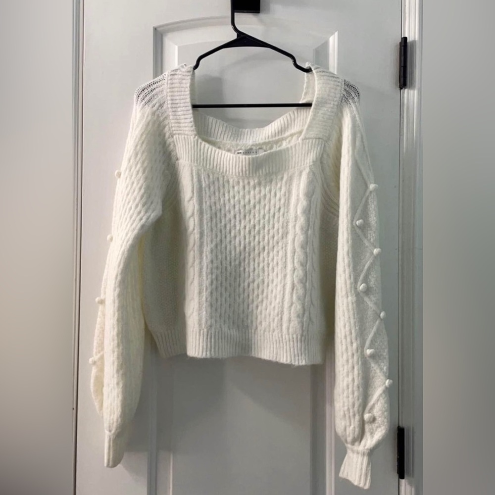 White pom pom sweater